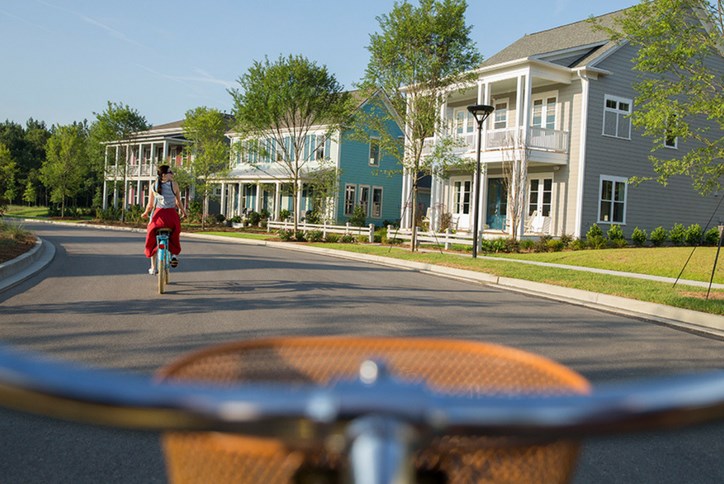 Nexton-Homes-Woman-on-Bicycle.png