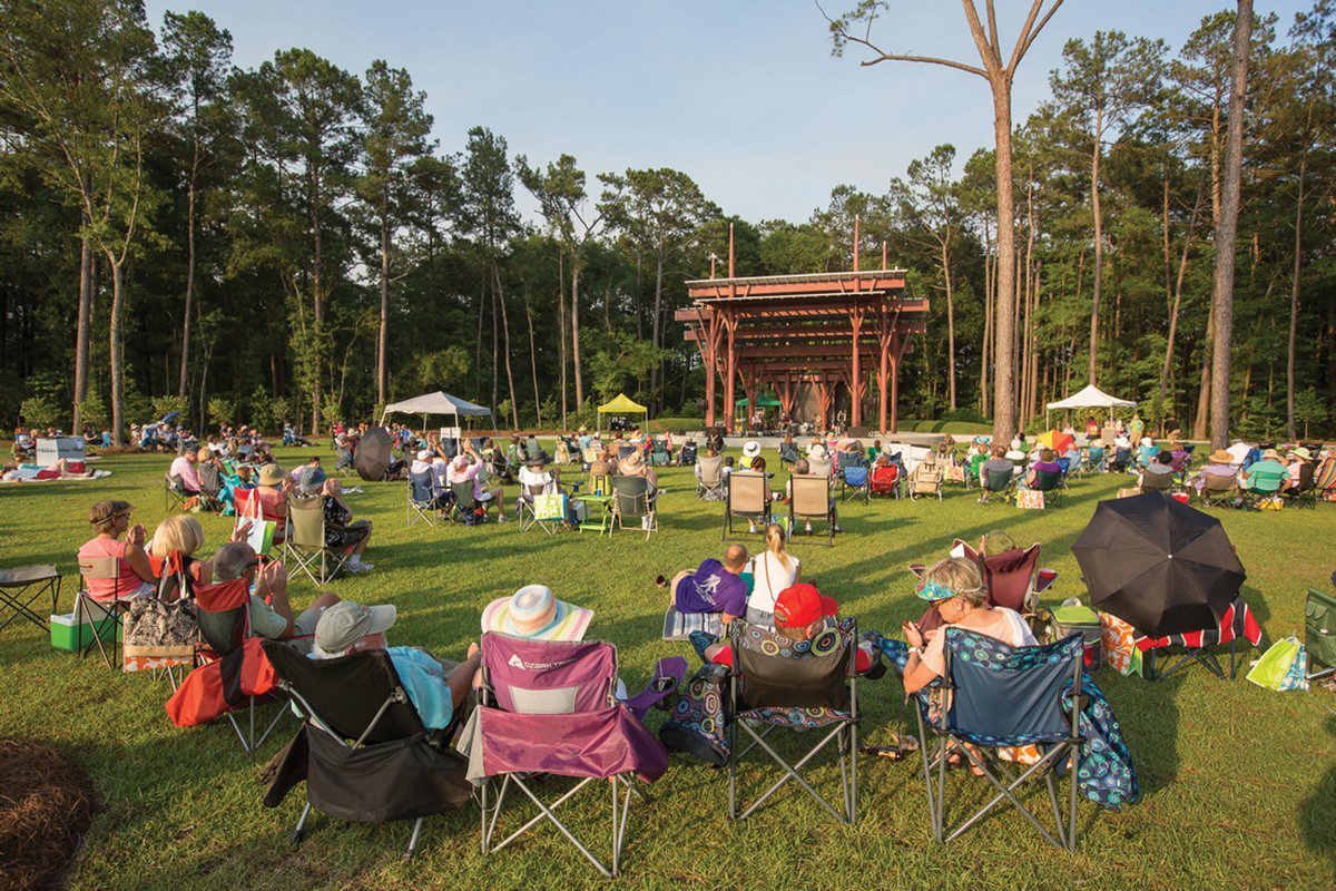Crowd in lawn chairs enjoying concert in the park