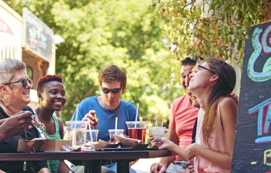 Folks gathered around picnic table for lunch