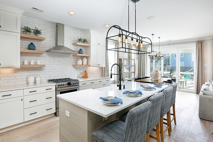 Kitchen with large island in Homes By Dickerson model in Nexton.