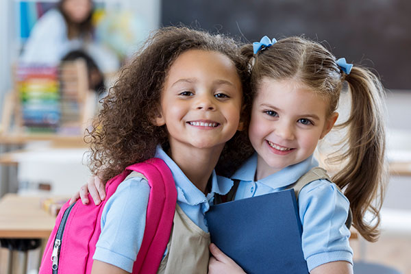 Young school girls in classroom.