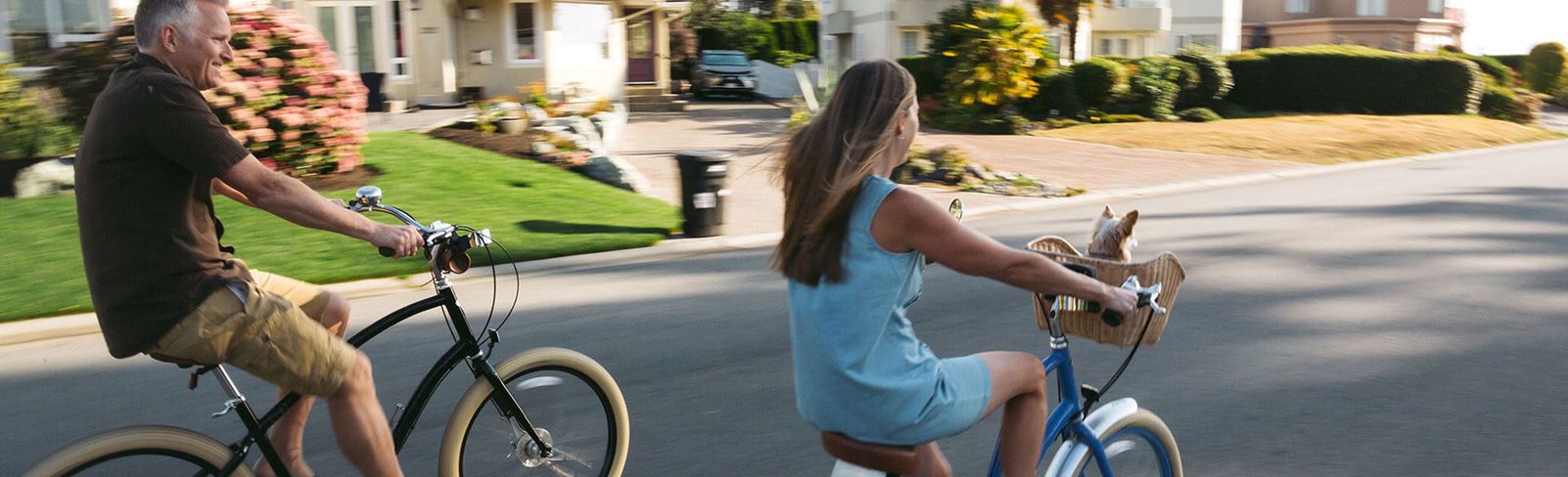 Man and daughter riding bicycles in Nexton.