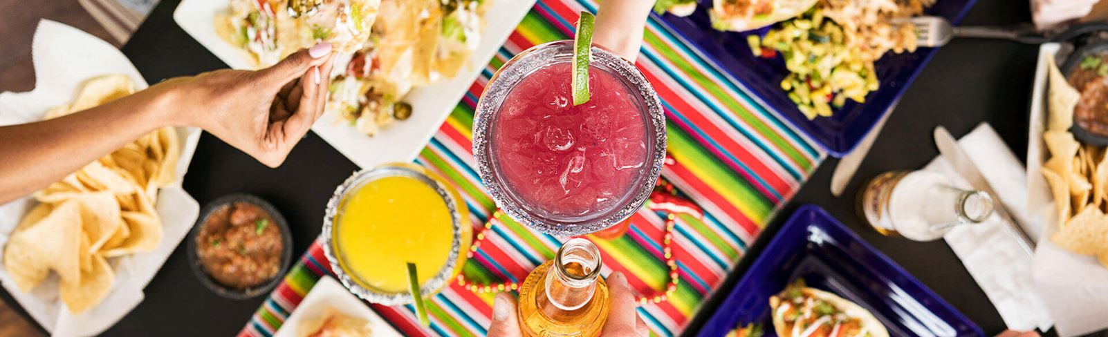 Colorful table of yummy mexican food.