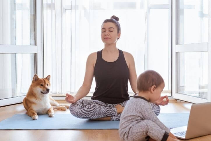 Woman practicing yoga at home