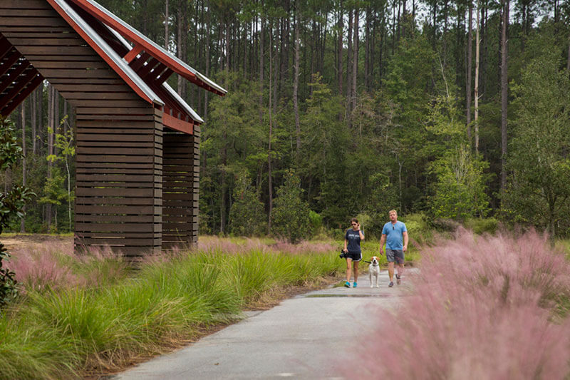 Couple walking trail in Nexton