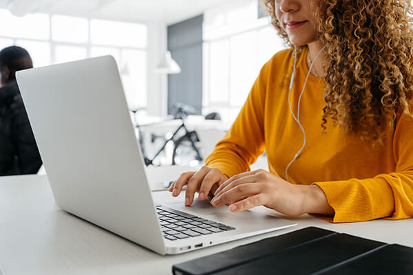 Working on laptop, Nexton co-working space.