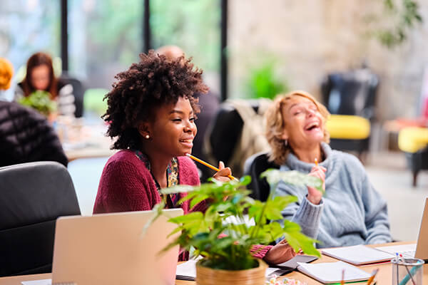 Co-workers collaborating, Nexton co-working space