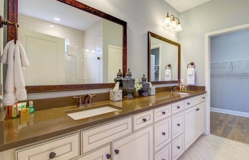 Del Webb Abbeyville home plan owner's suite bathroom with dual sinks