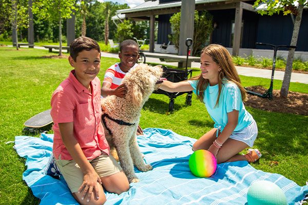 Kids enjoying outdoor space at Midtown Club in Nexton