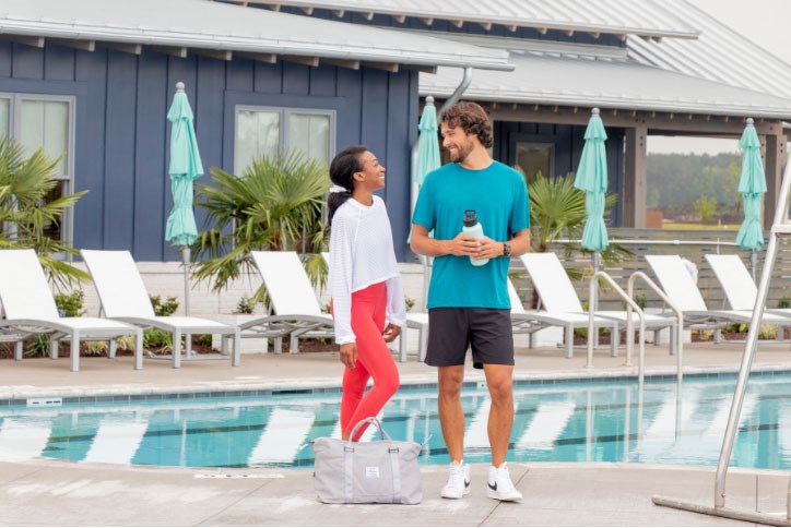 Couple poolside at Midtown Club, Nexton