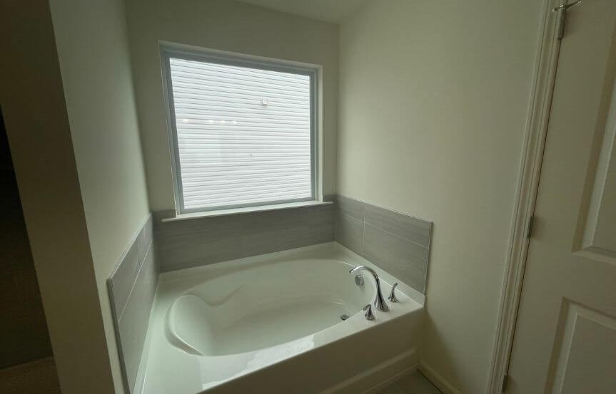 True Homes Kipling spec home plan lot 556 owner's suite bathroom soaking tub