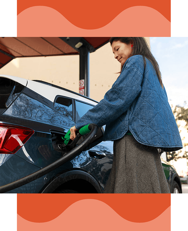 Woman getting gas